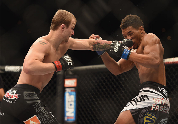 LAS VEGAS, NV - JULY 06: (L-R) Jesse Ronson punches Kevin Lee in their flyweight fight during the Ultimate Fighter Finale inside the Mandalay Bay Events Center on July 6, 2014 in Las Vegas, Nevada. (Photo by Jeff Bottari/Zuffa LLC/Zuffa LLC via Getty Im