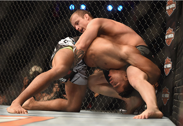 LAS VEGAS, NV - JULY 06: (L-R) Kevin Lee attempts to take down Jesse Ronson in their flyweight fight during the Ultimate Fighter Finale inside the Mandalay Bay Events Center on July 6, 2014 in Las Vegas, Nevada. (Photo by Jeff Bottari/Zuffa LLC/Zuffa LL