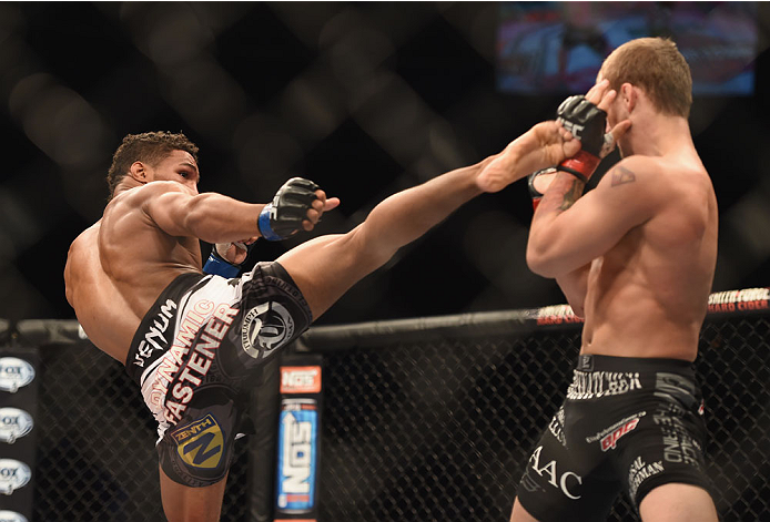 LAS VEGAS, NV - JULY 06:  (L-R) Kevin Lee kicks Jesse Ronson in their flyweight fight during the Ultimate Fighter Finale inside the Mandalay Bay Events Center on July 6, 2014 in Las Vegas, Nevada.  (Photo by Jeff Bottari/Zuffa LLC/Zuffa LLC via Getty Imag