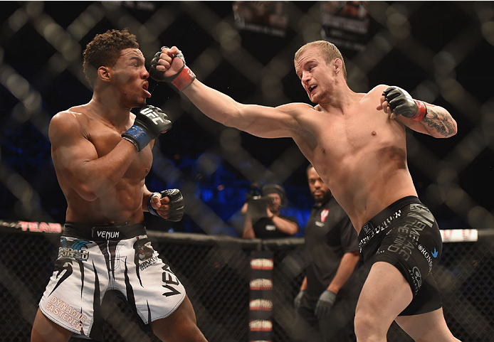 LAS VEGAS, NV - JULY 06:  (R-L) Jesse Ronson punches Kevin Lee in their flyweight fight during the Ultimate Fighter Finale inside the Mandalay Bay Events Center on July 6, 2014 in Las Vegas, Nevada.  (Photo by Jeff Bottari/Zuffa LLC/Zuffa LLC via Getty Im