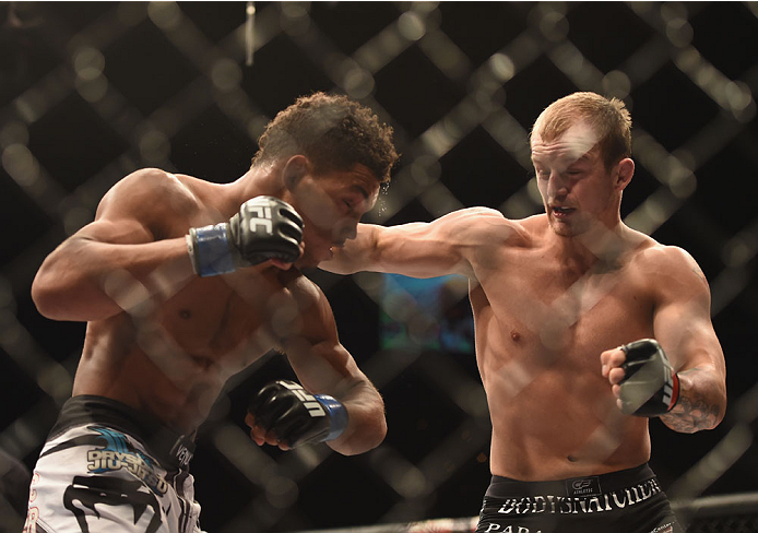 LAS VEGAS, NV - JULY 06: (R-L) Jesse Ronson punches Kevin Lee in their flyweight fight during the Ultimate Fighter Finale inside the Mandalay Bay Events Center on July 6, 2014 in Las Vegas, Nevada. (Photo by Jeff Bottari/Zuffa LLC/Zuffa LLC via Getty Im