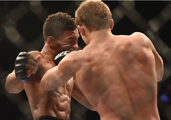 LAS VEGAS, NV - JULY 06: (R-L) Jesse Ronson punches Kevin Lee in their flyweight fight during the Ultimate Fighter Finale inside the Mandalay Bay Events Center on July 6, 2014 in Las Vegas, Nevada. (Photo by Jeff Bottari/Zuffa LLC/Zuffa LLC via Getty Im