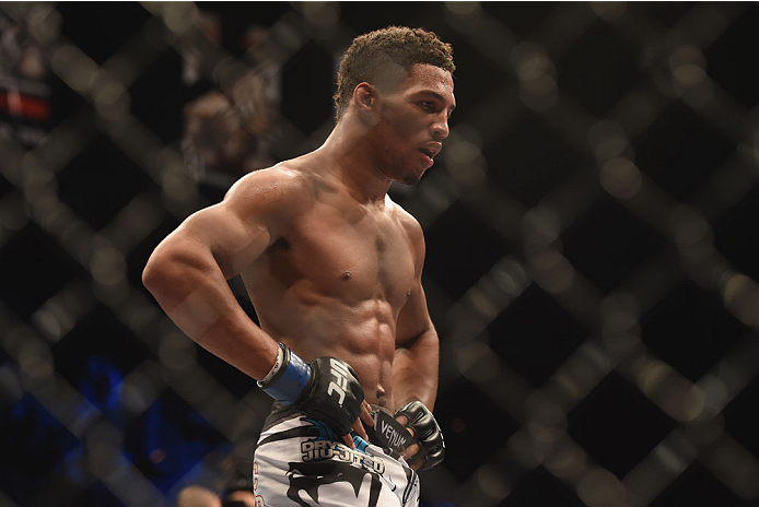 LAS VEGAS, NV - JULY 06:  Kevin Lee takes a breath in between rounds against Jesse Ronson in their flyweight fight during the Ultimate Fighter Finale inside the Mandalay Bay Events Center on July 6, 2014 in Las Vegas, Nevada.  (Photo by Jeff Bottari/Zuffa