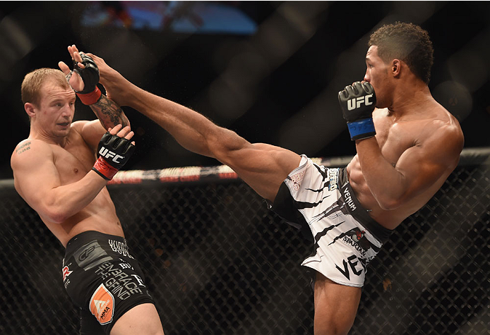 LAS VEGAS, NV - JULY 06:  (R-L) Kevin Lee kicks Jesse Ronson in their flyweight fight during the Ultimate Fighter Finale inside the Mandalay Bay Events Center on July 6, 2014 in Las Vegas, Nevada.  (Photo by Jeff Bottari/Zuffa LLC/Zuffa LLC via Getty Imag