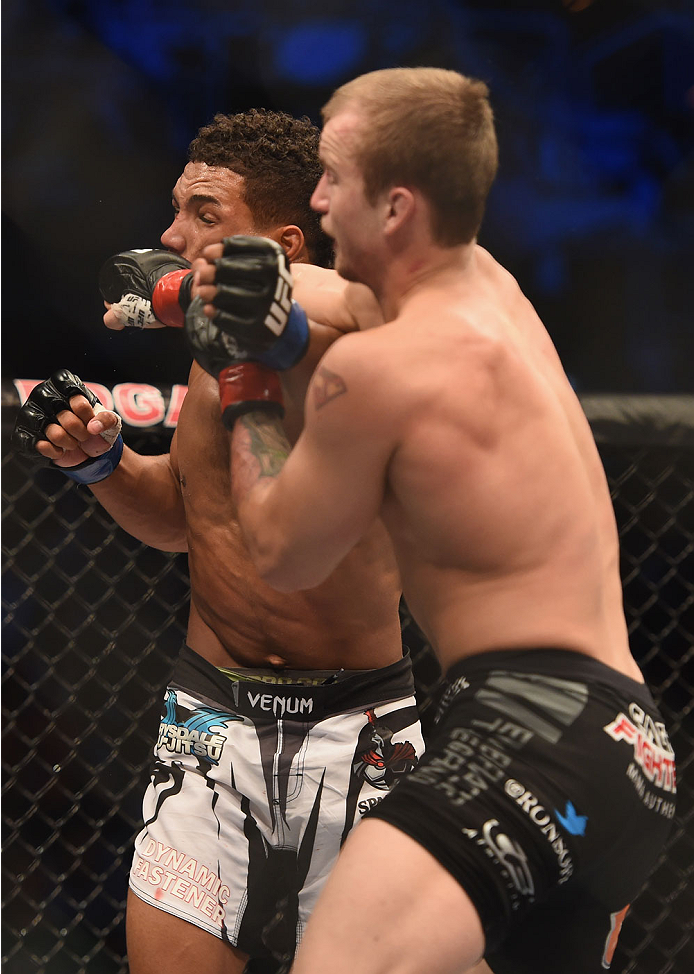 LAS VEGAS, NV - JULY 06: (R-L) Jesse Ronson punches Kevin Lee in their flyweight fight during the Ultimate Fighter Finale inside the Mandalay Bay Events Center on July 6, 2014 in Las Vegas, Nevada. (Photo by Jeff Bottari/Zuffa LLC/Zuffa LLC via Getty Im
