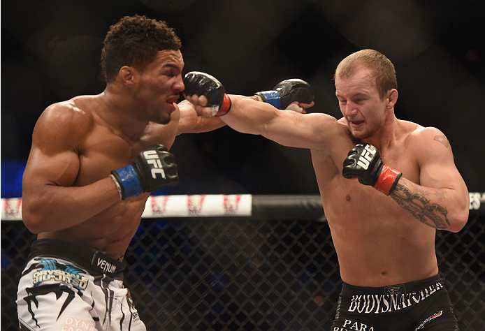 LAS VEGAS, NV - JULY 06:  (R-L) Jesse Ronson punches Kevin Lee in their flyweight fight during the Ultimate Fighter Finale inside the Mandalay Bay Events Center on July 6, 2014 in Las Vegas, Nevada.  (Photo by Jeff Bottari/Zuffa LLC/Zuffa LLC via Getty Im