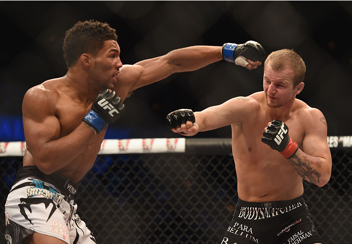 LAS VEGAS, NV - JULY 06: (R-L) Jesse Ronson punches Kevin Lee in their flyweight fight during the Ultimate Fighter Finale inside the Mandalay Bay Events Center on July 6, 2014 in Las Vegas, Nevada. (Photo by Jeff Bottari/Zuffa LLC/Zuffa LLC via Getty Im
