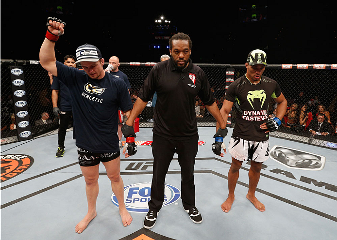 LAS VEGAS, NV - JULY 06: (R-L) Kevin Lee and Jesse Ronson wait for the decision in their flyweight fight during the Ultimate Fighter Finale inside the Mandalay Bay Events Center on July 6, 2014 in Las Vegas, Nevada. (Photo by Josh Hedges/Zuffa LLC/Zuffa