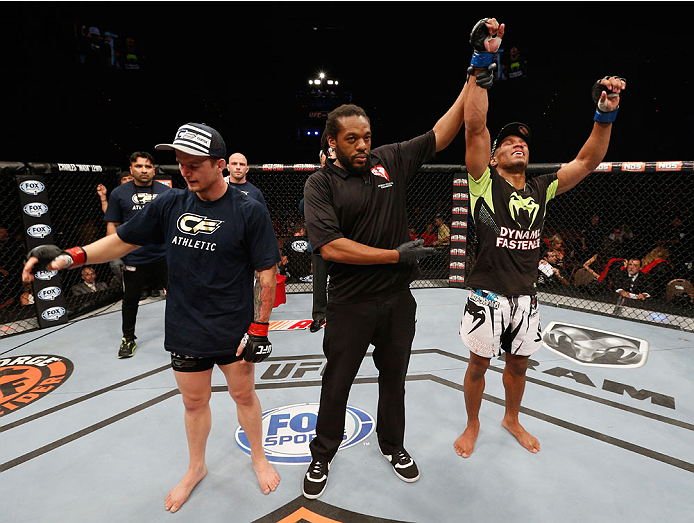 LAS VEGAS, NV - JULY 06: (R-L) Kevin Lee celebrates after defeating Jesse Ronson in their flyweight fight during the Ultimate Fighter Finale inside the Mandalay Bay Events Center on July 6, 2014 in Las Vegas, Nevada. (Photo by Josh Hedges/Zuffa LLC/Zuff