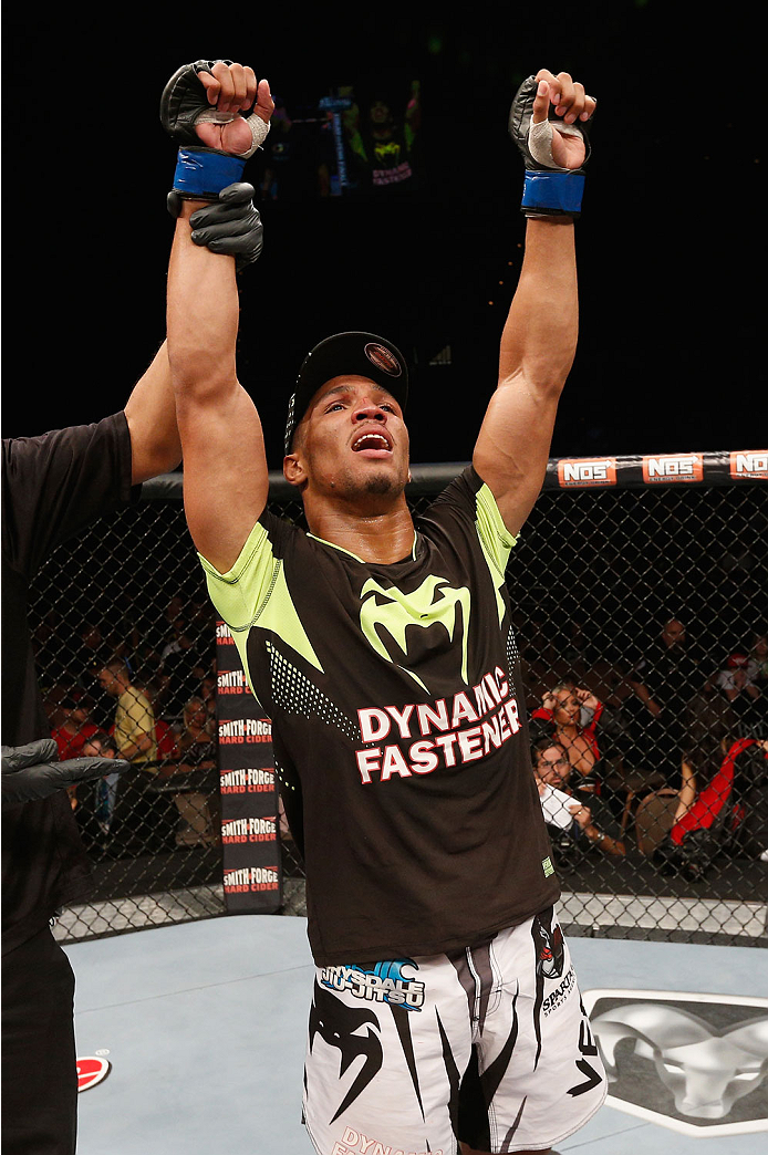 LAS VEGAS, NV - JULY 06:  Kevin Lee celebrates after defeating Jesse Ronson in their flyweight fight during the Ultimate Fighter Finale inside the Mandalay Bay Events Center on July 6, 2014 in Las Vegas, Nevada.  (Photo by Josh Hedges/Zuffa LLC/Zuffa LLC 