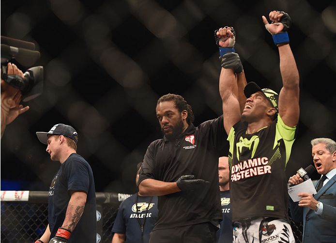 LAS VEGAS, NV - JULY 06:  (R-L) Kevin Lee celebrates after defeating Jesse Ronson in their flyweight fight during the Ultimate Fighter Finale inside the Mandalay Bay Events Center on July 6, 2014 in Las Vegas, Nevada.  (Photo by Jeff Bottari/Zuffa LLC/Zuf