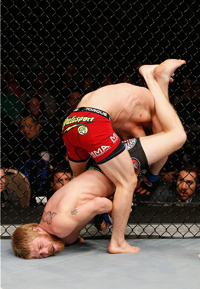 LAS VEGAS, NV - JULY 06: Justin Scoggins (bottom) attempts an armbar on Dustin Ortiz in their flyweight fight during the Ultimate Fighter Finale inside the Mandalay Bay Events Center on July 6, 2014 in Las Vegas, Nevada. (Photo by Josh Hedges/Zuffa LLC/