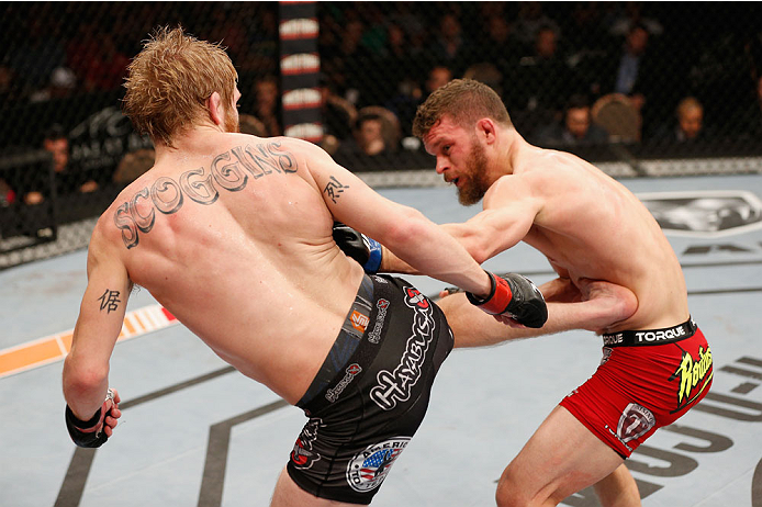 LAS VEGAS, NV - JULY 06: (L-R) Justin Scoggins kicks Dustin Ortiz in their flyweight fight during the Ultimate Fighter Finale inside the Mandalay Bay Events Center on July 6, 2014 in Las Vegas, Nevada. (Photo by Josh Hedges/Zuffa LLC/Zuffa LLC via Getty