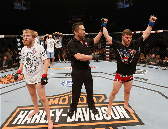 LAS VEGAS, NV - JULY 06:  (R-L) Dustin Scoggins celebrates defeating Justin Scoggins by decision in their flyweight fight during the Ultimate Fighter Finale inside the Mandalay Bay Events Center on July 6, 2014 in Las Vegas, Nevada.  (Photo by Josh Hedges