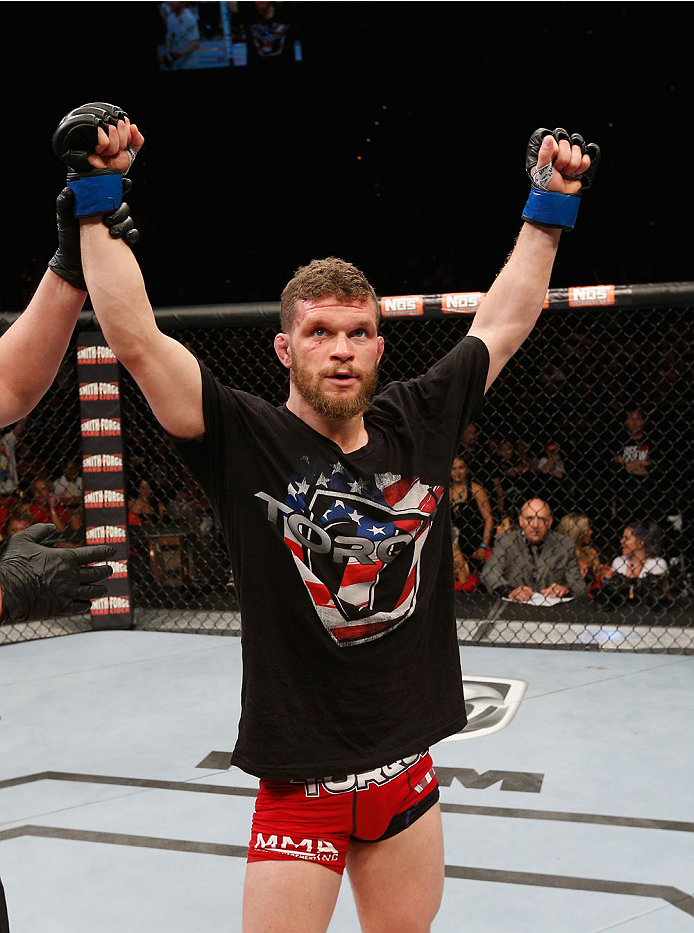 LAS VEGAS, NV - JULY 06: Dustin Scoggins celebrates defeating Justin Scoggins by decision in their flyweight fight during the Ultimate Fighter Finale inside the Mandalay Bay Events Center on July 6, 2014 in Las Vegas, Nevada. (Photo by Josh Hedges/Zuffa