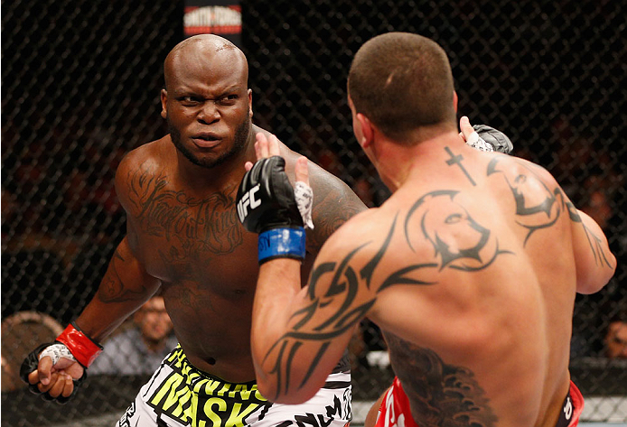 LAS VEGAS, NV - JULY 06: (L-R) Derrick Lewis punches Guto Inocente in their heavyweight fight during the Ultimate Fighter Finale inside the Mandalay Bay Events Center on July 6, 2014 in Las Vegas, Nevada. (Photo by Josh Hedges/Zuffa LLC/Zuffa LLC via Ge