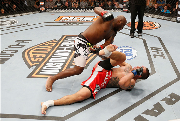 LAS VEGAS, NV - JULY 06:  Derrick Lewis (top) punches Guto Inocente in their heavyweight fight during the Ultimate Fighter Finale inside the Mandalay Bay Events Center on July 6, 2014 in Las Vegas, Nevada.  (Photo by Josh Hedges/Zuffa LLC/Zuffa LLC via Ge