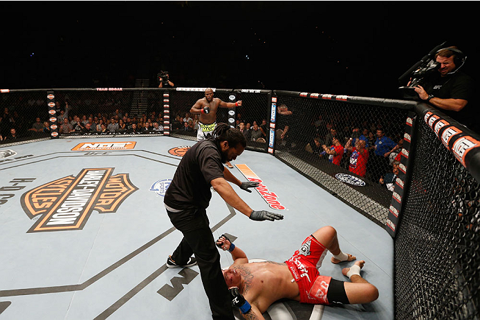 LAS VEGAS, NV - JULY 06: (L-R) Derrick Lewis celebrates defeating Guto Inocente in their heavyweight fight during the Ultimate Fighter Finale inside the Mandalay Bay Events Center on July 6, 2014 in Las Vegas, Nevada. (Photo by Josh Hedges/Zuffa LLC/Zuf