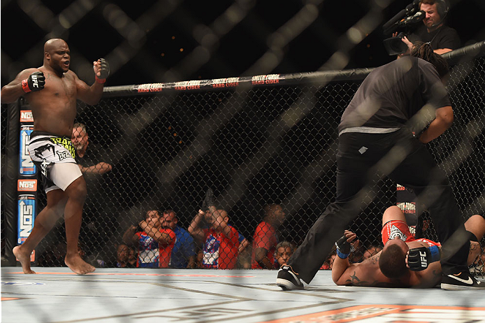 LAS VEGAS, NV - JULY 06:  (L-R) Derrick Lewis celebrates after defeating Guto Inocente in their middleweight fight during the Ultimate Fighter Finale inside the Mandalay Bay Events Center on July 6, 2014 in Las Vegas, Nevada.  (Photo by Jeff Bottari/Zuffa