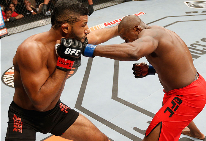 LAS VEGAS, NV - JULY 06:  (R-L) Eddie Gordon and Dhiego Lima exchange punches in their middleweight fight during the Ultimate Fighter Finale inside the Mandalay Bay Events Center on July 6, 2014 in Las Vegas, Nevada.  (Photo by Josh Hedges/Zuffa LLC/Zuffa