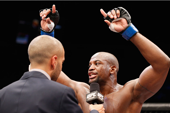 LAS VEGAS, NV - JULY 06: (L-R) Jon Anik interviews Eddie Gordon after he defeated Dhiego Lima middleweight fight during the Ultimate Fighter Finale inside the Mandalay Bay Events Center on July 6, 2014 in Las Vegas, Nevada. (Photo by Josh Hedges/Zuffa L