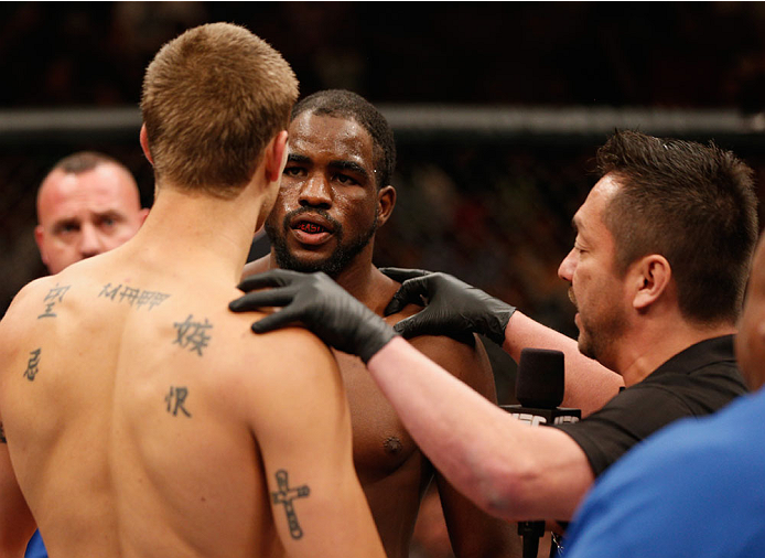 LAS VEGAS, NV - JULY 06:  (R-L) Referee Mario Yamasaki explains the rules to Corey Anderson and Matt Van Buren before their light heavyweight fight during the Ultimate Fighter Finale inside the Mandalay Bay Events Center on July 6, 2014 in Las Vegas, Neva