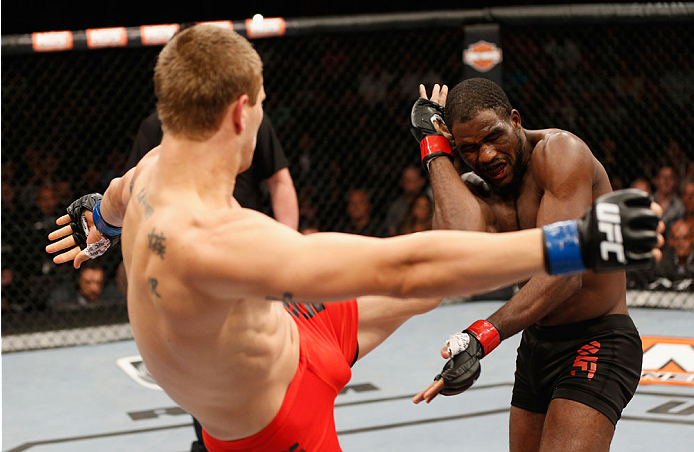 LAS VEGAS, NV - JULY 06:  (L-R) Matt Van Buren kicks Corey Anderson in their light heavyweight fight during the Ultimate Fighter Finale inside the Mandalay Bay Events Center on July 6, 2014 in Las Vegas, Nevada.  (Photo by Josh Hedges/Zuffa LLC/Zuffa LLC 