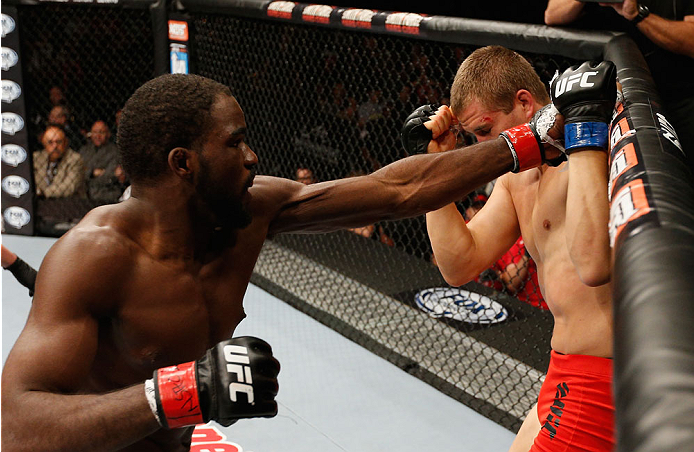 LAS VEGAS, NV - JULY 06:  (L-R) Corey Anderson punches Matt Van Buren in their light heavyweight fight during the Ultimate Fighter Finale inside the Mandalay Bay Events Center on July 6, 2014 in Las Vegas, Nevada.  (Photo by Josh Hedges/Zuffa LLC/Zuffa LL