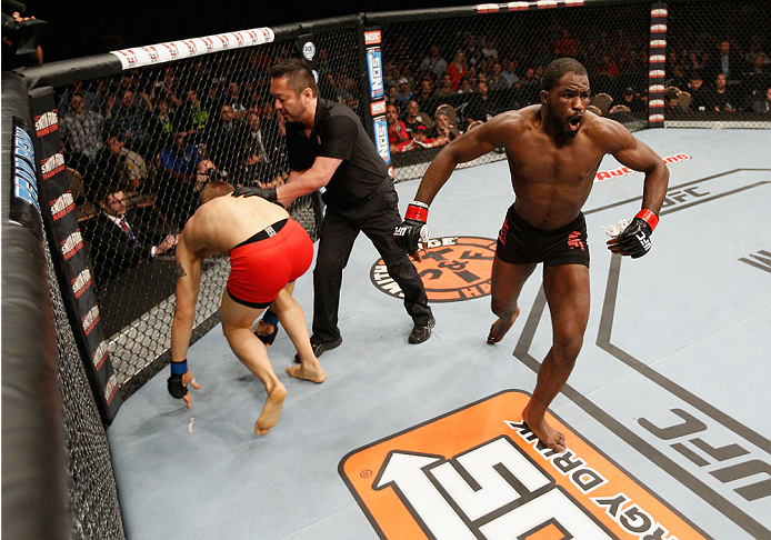 LAS VEGAS, NV - JULY 06:  (R-L) Corey Anderson celebrates after defeating Matt Van Buren in their light heavyweight fight during the Ultimate Fighter Finale inside the Mandalay Bay Events Center on July 6, 2014 in Las Vegas, Nevada.  (Photo by Josh Hedges