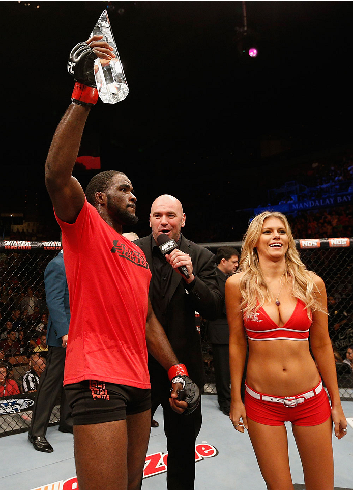 LAS VEGAS, NV - JULY 06: (L-R) Corey Anderson gets awarded the Ultimate Fighter season 19 trophy after defeating Matt Van Buren in their light heavyweight fight during the Ultimate Fighter Finale inside the Mandalay Bay Events Center on July 6, 2014 in L