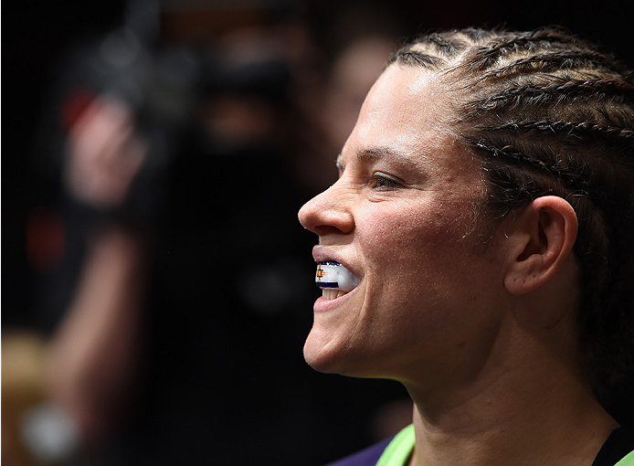 LAS VEGAS, NEVADA - DECEMBER 12: Emily Kagan prepares to enter the Octagon before facing Angela Hill in their strawweight fight during The Ultimate Fighter Finale event inside the Pearl concert theater at the Palms Casino Resort on December 12, 2014 in La
