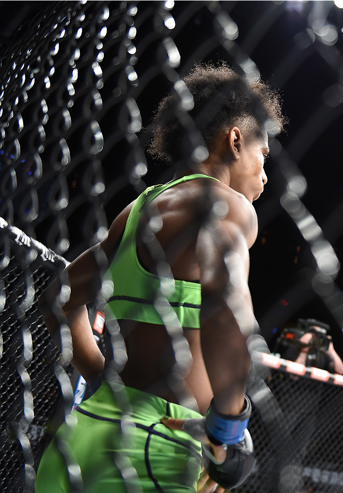 LAS VEGAS, NEVADA - DECEMBER 12: Angela Hill enters the Octagon before facing Emily Kagan in their strawweight fight during The Ultimate Fighter Finale event inside the Pearl concert theater at the Palms Casino Resort on December 12, 2014 in Las Vegas, Ne