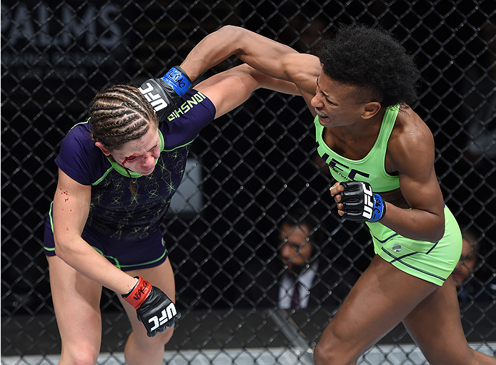 LAS VEGAS, NEVADA - DECEMBER 12: (R-L) Angela Hill punches Emily Kagan in their strawweight fight during The Ultimate Fighter Finale event inside the Pearl concert theater at the Palms Casino Resort on December 12, 2014 in Las Vegas, Nevada. (Photo by Je