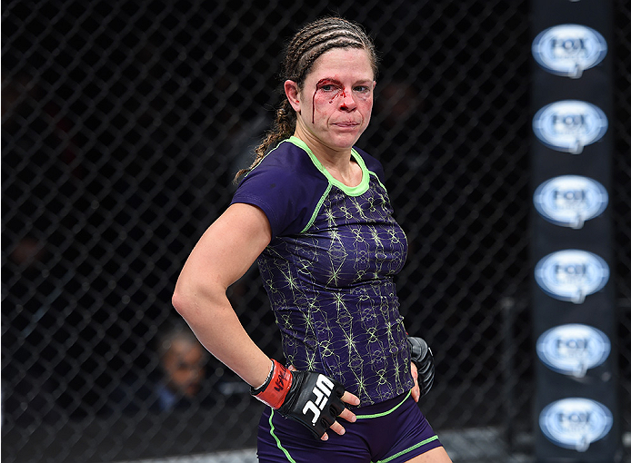 LAS VEGAS, NEVADA - DECEMBER 12: Emily Kagan walks to her corner in between rounds against Angela Hill in their strawweight fight during The Ultimate Fighter Finale event inside the Pearl concert theater at the Palms Casino Resort on December 12, 2014 in