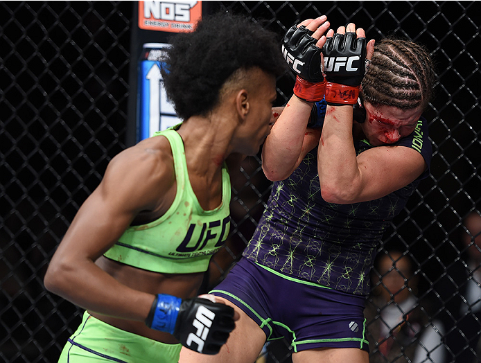 LAS VEGAS, NEVADA - DECEMBER 12: (L-R) Angela Hill punches Emily Kagan in their strawweight fight during The Ultimate Fighter Finale event inside the Pearl concert theater at the Palms Casino Resort on December 12, 2014 in Las Vegas, Nevada. (Photo by Jef