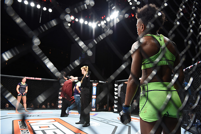 LAS VEGAS, NEVADA - DECEMBER 12: (R-L) Angela Hill looks across the Octagon at her opponent Emily Kagan in their strawweight fight during The Ultimate Fighter Finale event inside the Pearl concert theater at the Palms Casino Resort on December 12, 2014 in