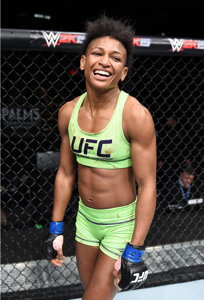 LAS VEGAS, NEVADA - DECEMBER 12: Angela Hill reacts after her victory over Emily Kagan in their strawweight fight during The Ultimate Fighter Finale event inside the Pearl concert theater at the Palms Casino Resort on December 12, 2014 in Las Vegas, Nevad
