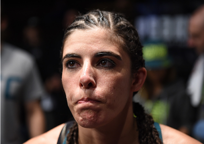 LAS VEGAS, NEVADA - DECEMBER 12: Alex Chambers prepares to enter the Octagon before facing Aisling Daly in their strawweight fight during The Ultimate Fighter Finale event inside the Pearl concert theater at the Palms Casino Resort on December 12, 2014 i