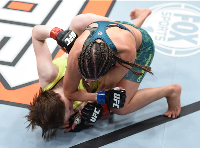 LAS VEGAS, NEVADA - DECEMBER 12: Alex Chambers (top) elbows Aisling Daly in their strawweight fight during The Ultimate Fighter Finale event inside the Pearl concert theater at the Palms Casino Resort on December 12, 2014 in Las Vegas, Nevada. (Photo by