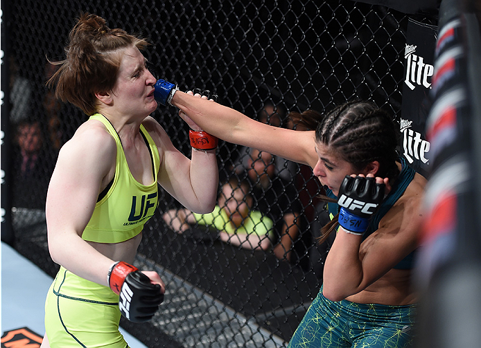 LAS VEGAS, NEVADA - DECEMBER 12: (R-L) Alex Chambers punches Aisling Daly in their strawweight fight during The Ultimate Fighter Finale event inside the Pearl concert theater at the Palms Casino Resort on December 12, 2014 in Las Vegas, Nevada. (Photo by