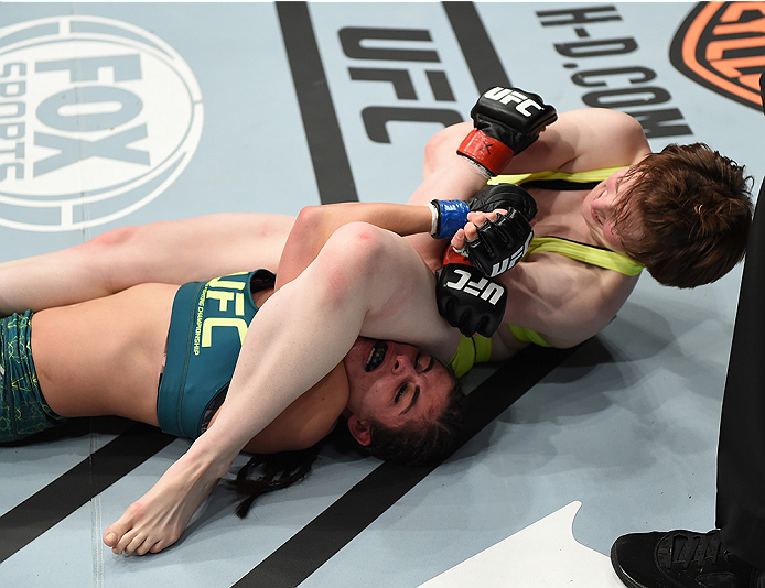 LAS VEGAS, NEVADA - DECEMBER 12: (R-L) Aisling Daly attempts to submit Alex Chambers in their strawweight fight during The Ultimate Fighter Finale event inside the Pearl concert theater at the Palms Casino Resort on December 12, 2014 in Las Vegas, Nevada
