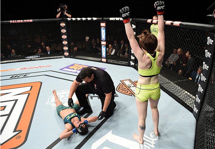 LAS VEGAS, NEVADA - DECEMBER 12: (R-L) Aisling Daly celebrates her submission victory over Alex Chambers in their strawweight fight during The Ultimate Fighter Finale event inside the Pearl concert theater at the Palms Casino Resort on December 12, 2014