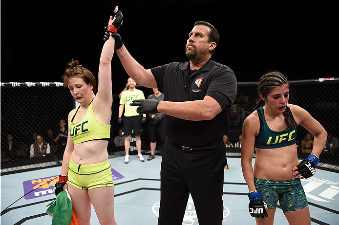 LAS VEGAS, NEVADA - DECEMBER 12: (L-R) Aisling Daly celebrates her submission victory over Alex Chambers in their strawweight fight during The Ultimate Fighter Finale event inside the Pearl concert theater at the Palms Casino Resort on December 12, 2014