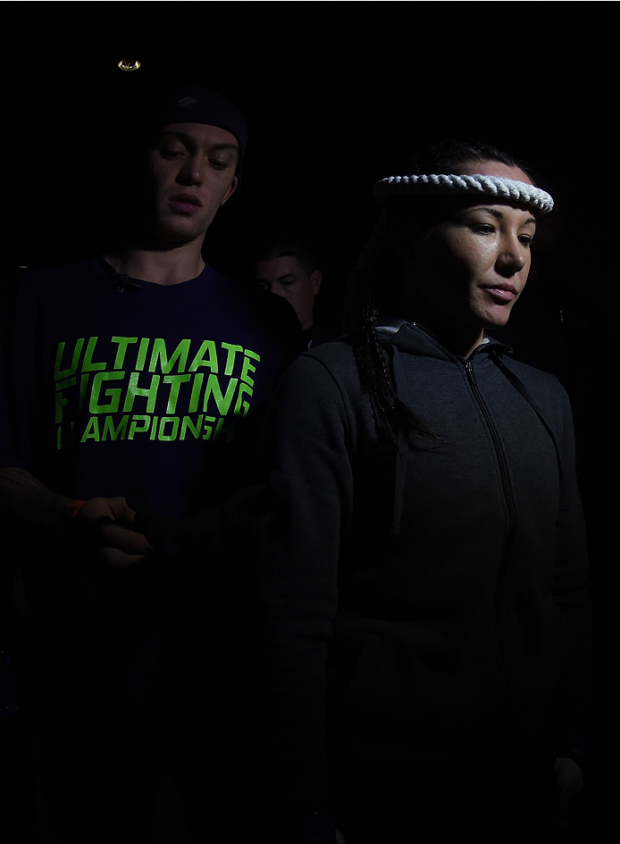 LAS VEGAS, NEVADA - DECEMBER 12: Angela Magana prepares to enter the Octagon before facing Tecia Torres in their strawweight fight during The Ultimate Fighter Finale event inside the Pearl concert theater at the Palms Casino Resort on December 12, 2014 i