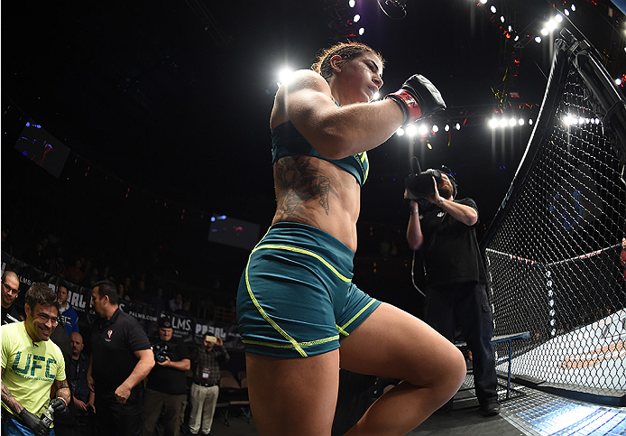 LAS VEGAS, NEVADA - DECEMBER 12: Tecia Torres enters the Octagon before facing Angela Magana in their strawweight fight during The Ultimate Fighter Finale event inside the Pearl concert theater at the Palms Casino Resort on December 12, 2014 in Las Vegas