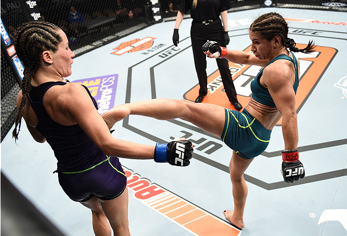 LAS VEGAS, NEVADA - DECEMBER 12: (R-L) Tecia Torres kicks Angela Magana in their strawweight fight during The Ultimate Fighter Finale event inside the Pearl concert theater at the Palms Casino Resort on December 12, 2014 in Las Vegas, Nevada. (Photo by J