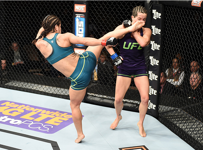LAS VEGAS, NEVADA - DECEMBER 12: (L-R) Tecia Torres kicks Angela Magana in their strawweight fight during The Ultimate Fighter Finale event inside the Pearl concert theater at the Palms Casino Resort on December 12, 2014 in Las Vegas, Nevada. (Photo by J