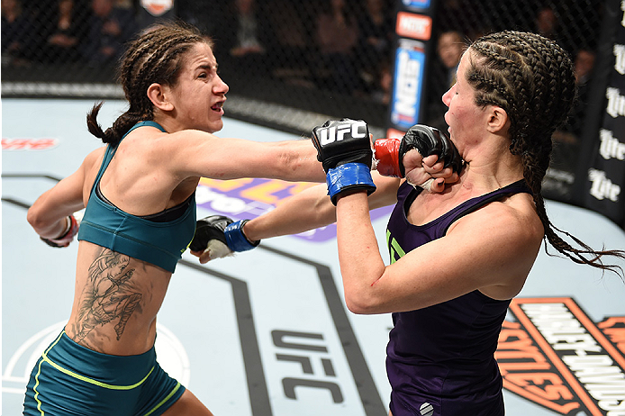 LAS VEGAS, NEVADA - DECEMBER 12: (L-R) Tecia Torres punches Angela Magana in their strawweight fight during The Ultimate Fighter Finale event inside the Pearl concert theater at the Palms Casino Resort on December 12, 2014 in Las Vegas, Nevada. (Photo by