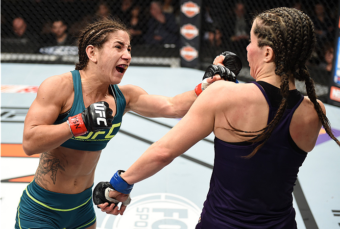 LAS VEGAS, NEVADA - DECEMBER 12: (L-R) Tecia Torres punches Angela Magana in their strawweight fight during The Ultimate Fighter Finale event inside the Pearl concert theater at the Palms Casino Resort on December 12, 2014 in Las Vegas, Nevada. (Photo by