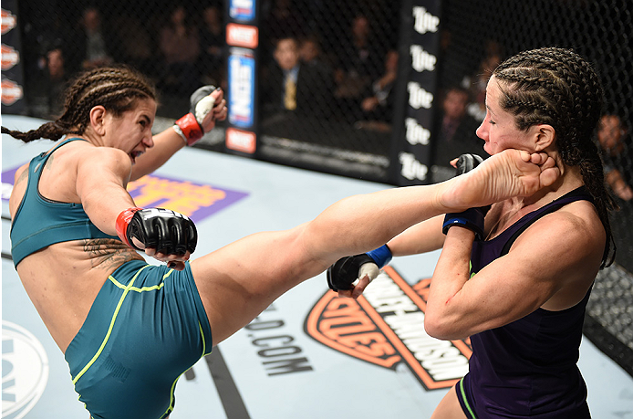 LAS VEGAS, NEVADA - DECEMBER 12: (L-R) Tecia Torres kicks Angela Magana in their strawweight fight during The Ultimate Fighter Finale event inside the Pearl concert theater at the Palms Casino Resort on December 12, 2014 in Las Vegas, Nevada. (Photo by J